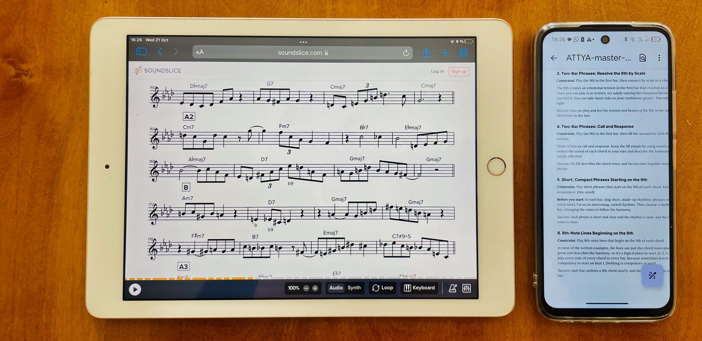 A 9th workout open in Soundslice on an iPad, with its master notes on a phone beside it